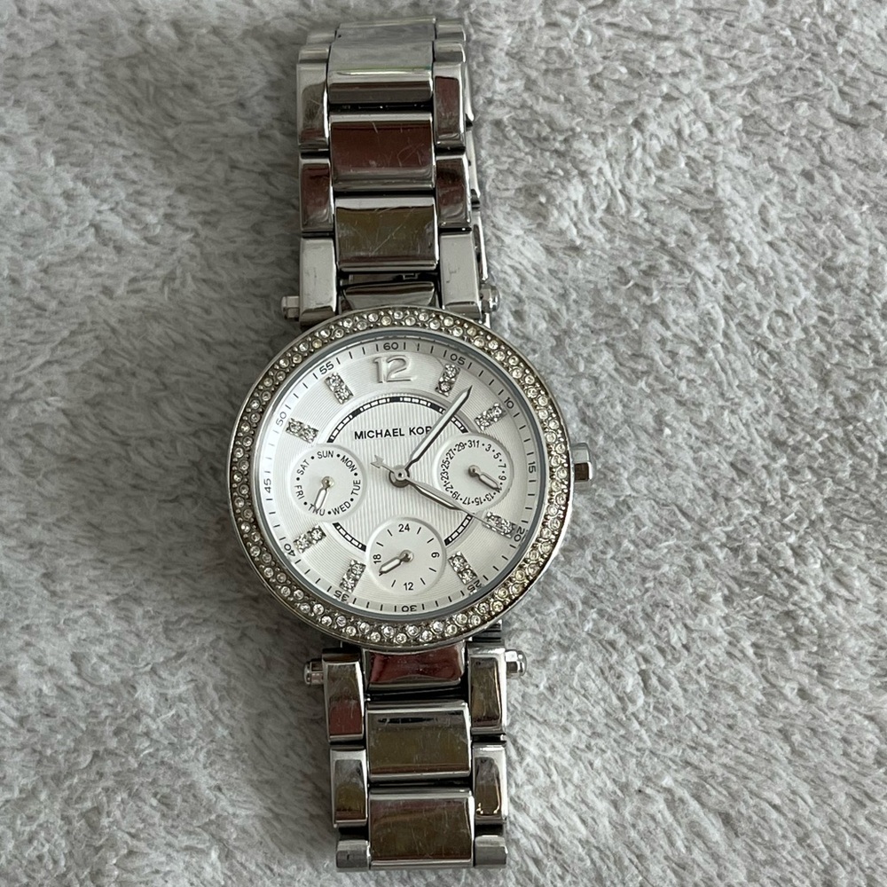 Michael Kors Women’s Silver Watch with diamond accents and white face